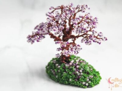 Miniature cherry blossom wire tree on a green patch