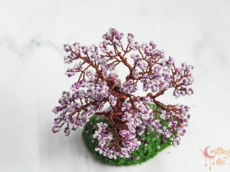 Miniature cherry blossom wire tree on a green patch