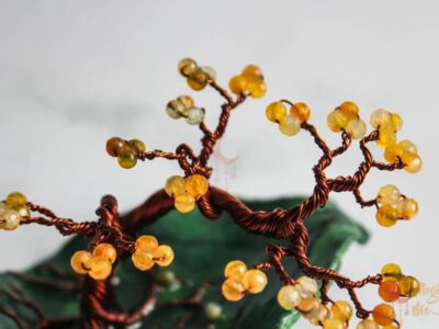 Miniature wire tree on an abstract leaf